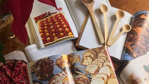 A display of cookbooks and utensils