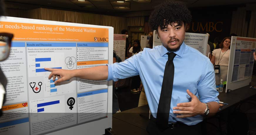 A student presenting his research during URCAD