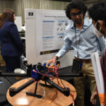A young researcher exhibiting a drone