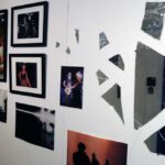 Photographs and abstract artwork hanging on the wall