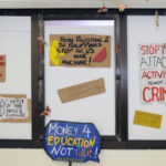 A graphic poster displaying slogans about protest