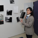 A young undergraduate researcher presenting her research to the public