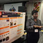 A young undergraduate researcher presenting her research to the public