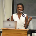 The keynote speaker discussing her past project